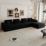 Goldoma modular loveseat sofa bed in black corduroy upholstery with iron legs, showing sofa bed conversion for small spaces