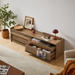 Goldoma modern TV stand with LED lights and charging ports for TVs up to 75 inches featuring four drawers and tempered glass top