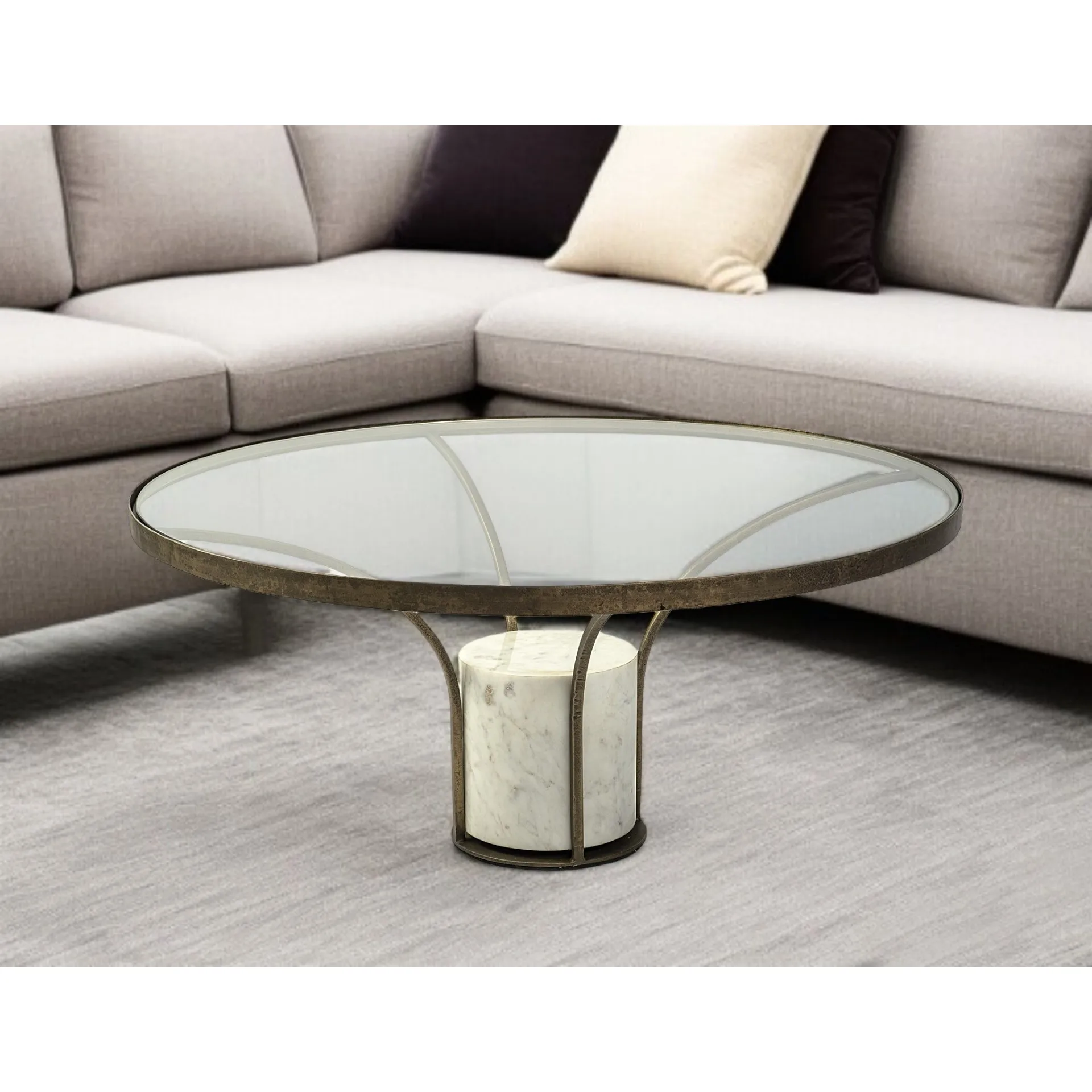 Haee05a35ce6046bb8b9fbaf7d44e84a6J.webp Goldoma 36-inch round pedestal coffee table with antiqued gold base and clear glass top