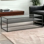 Goldoma 54-inch black glass coffee table with shelf in a modern farmhouse living room setting