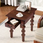Goldoma narrow sofa side table with drawer in walnut finish, solid wood construction, placed beside a couch in a small living room
