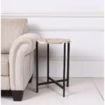 Goldoma brown tan marble round end table with black metal base in living room