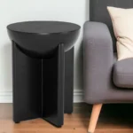Black mango wood pedestal end table with geometric base in living room