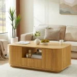 Modern oval coffee table with drawers and shelf in natural solid wood placed in living room