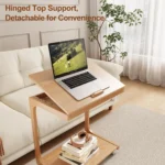 Goldoma C-shaped end table with lockable wheels in natural wood finish, placed under a sofa as a rolling side table