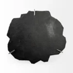 Goldoma 40 inch free form coffee table with distressed black stone top and gold iron base in a living room