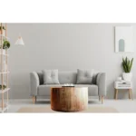 Goldoma 34-inch natural solid wood round coffee table in a modern living room setting