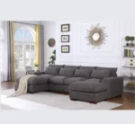 U-shaped sectional sofa with two ottomans and reclining seats in a modern living room