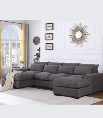 U-shaped sectional sofa with two ottomans and reclining seats in a modern living room