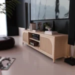 Goldoma mid-century modern bamboo TV stand with metal shelves for 60-64 inch TVs in a living room