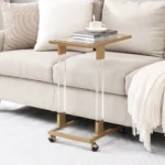 Modern c shape glass side table with chrome base and acrylic accents sliding under sofa in living room