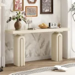 Modern acacia veneer console table in gray and black finish placed in an entryway with decorative items on top