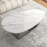 Modern sintered stone coffee table with stainless steel base in a stylish living room setting