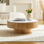 Goldoma nesting round coffee table with sintered stone top in a modern living room setting