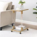 Modern c shape glass side table with chrome base and acrylic accents sliding under sofa in living room