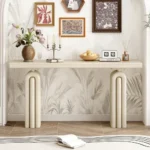 Modern acacia veneer console table in gray and black finish placed in an entryway with decorative items on top