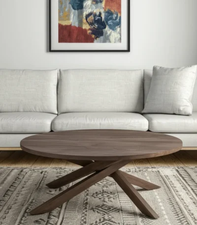 Goldoma 42-inch solid wood round coffee table with brown finish and cross legs in a living room