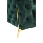 Goldoma 74-inch emerald velvet tufted Chesterfield loveseat with gold legs in a living room setting