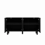 Modern buffet sideboard with four sunburst doors and solid wood legs in a living room setting