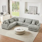 Goldoma 101.2-inch beige corduroy sectional sofa with deep seating and side pockets in a living room