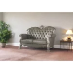 Goldoma 71-inch bone faux leather loveseat with tufted backrest, square arms, and toss pillows