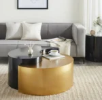 Modern gold coffee table with steel frame and metal top in a living room setting