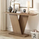Modern solid wood console table with V-base and storage shelf in a living room