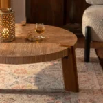 Goldoma round wood coffee table in farmhouse wabi sabi style with natural finish