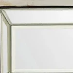 Silver mirrored console table with drawers by Goldoma in antiqued silver finish, 48 inches wide, placed in an entryway