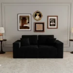 Goldoma modular loveseat sofa bed in black corduroy upholstery with iron legs, showing sofa bed conversion for small spaces