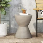 Light grey MGO side table on a patio with a drink and plant, showcasing its weather-resistant outdoor use.