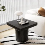 Goldoma modern nesting coffee table set in oak wood with cylindrical fluted pedestal on living room floor