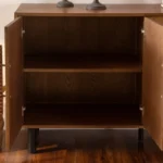 Goldoma gold sideboard buffet cabinet with solid wood arched doors and gold hardware in a modern dining room
