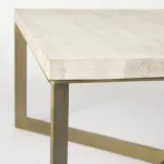 Goldoma 34 inch beige square coffee table with wood top and metal frame in a modern living room