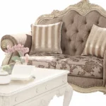Gray and off-white damask chesterfield loveseat with sleeper function and toss pillows by Goldoma
