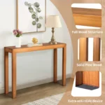 Goldoma 46-inch solid pinewood console table in light brown finish placed in an entryway with decorative accents