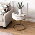 Goldoma modern nightstand with drawer featuring round marble-look sintered stone top and metal frame in a bedroom setting