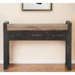 Goldoma narrow console table with drawers in solid oak and black metal sled base, placed in an entryway with decor