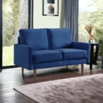 Blue velvet Chesterfield loveseat with dark brown wood legs – Goldoma 57-inch compact sofa for living room seating