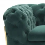 Goldoma 74-inch emerald velvet tufted Chesterfield loveseat with gold legs in a living room setting