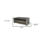 Goldoma 47-inch brown solid wood and dark gray concrete coffee table with drawer and shelf in a modern living room