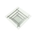 Goldoma 39-inch square glass coffee table with stainless steel sled base and lower shelf in a modern living room setting