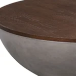Goldoma 48-inch round solid wood and concrete coffee table with brown top and gray base in a living room