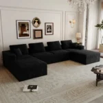 Goldoma modular loveseat sofa bed in black corduroy upholstery with iron legs, showing sofa bed conversion for small spaces