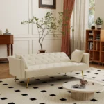 Modern 72-inch convertible sofa bed velvet tufted loveseat in beige, converted to bed mode in a living room