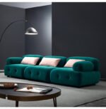 Goldoma L-shaped velvet sleeper sofa in modern living room with chaise and pull-out bed