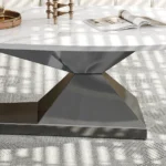 Modern sintered stone coffee table with stainless steel base in a stylish living room setting