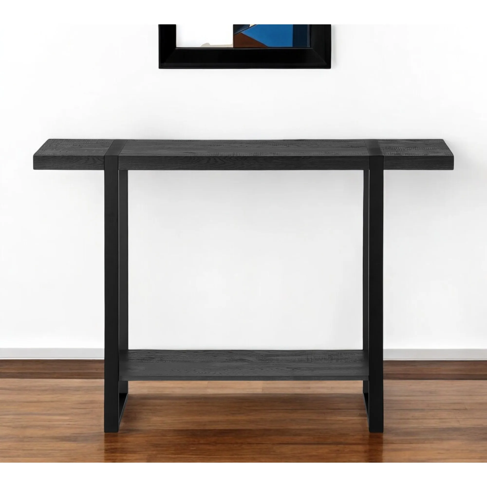 Hed23ba16cec64839903b95e4f4fd0a653.webp Goldoma 47-inch distressed sled console table in black faux wood and metal with lower shelf