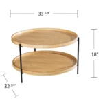 Goldoma 33-inch farmhouse round coffee table with natural wood top and black metal base in a living room