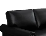 Goldoma black faux leather loveseat with memory foam cushions and wood legs in a modern living room
